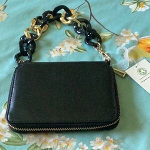 BLACK wallet with gold . Credit card slots on both sides inside. Coin area.